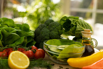 Red tomatoes, lettuce leaves on the table closeup. Vegetables for salad on table