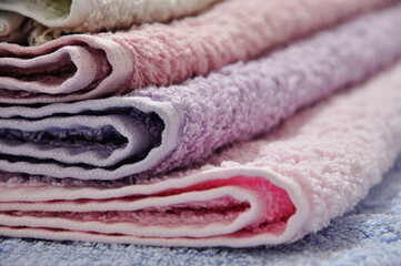 Colorful folded towels Bathroom concept idea photos. Close up shot. 