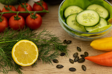 Red tomatoes, lettuce leaves on the table closeup. Vegetables for salad on table