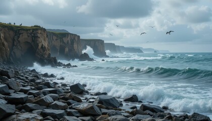 Obraz premium Dramatic Coastline with Waves and Rocky Shoreline Under Cloudy Sky
