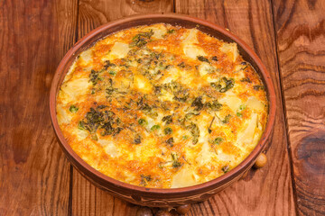 Prepared potato casserole with crust of melted cheese on top