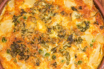 Prepared potato casserole with crust of melted cheese, top view