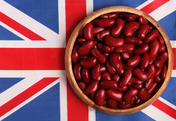 bowl of raw red beans on the flag of the united kingdom.Concept of traditional dishes of Great Britain