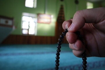 Muslim man rosary in his hand in mosque
