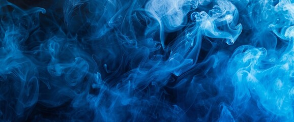 Obraz premium movement of blue smoke,Abstract blue smoke on black background, blue background,blue ink background,beautiful color smoke