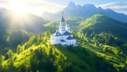 Serene sunrise illuminates a white church nestled atop verdant hills, majestic mountains forming a breathtaking backdrop