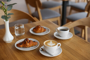 Delicious breakfast served on wooden table in cafe