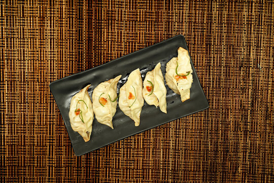 Grilled Gyoza or jiaozi fried stuffed dumplings 