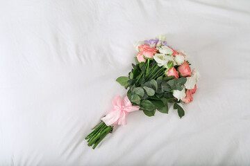 Wedding bouquet of beautiful flowers on linens, top view. Space for text