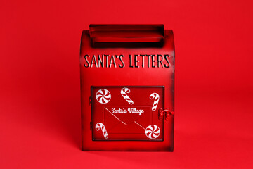 Santa Claus mailbox on red background. Christmas tradition