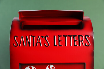Santa Claus mail box on dark green background, closeup. Christmas tradition