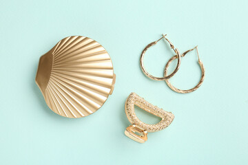 Stylish accessories on light blue background, flat lay