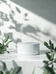 White Cream Jar with Eucalyptus Against Window Light