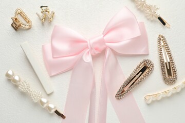 Different hair accessories on white table, flat lay