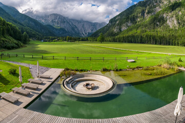 Luxury hotel swimming pool overlooking the stunning Alpine landscape in Logar Valley, Slovenia © Mazur Travel