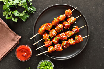 Teriyaki chicken skewers on plate