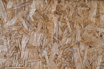 OSB wood texture background with rough and natural wooden patterns. Perfect for rustic, industrial, and eco-friendly designs.