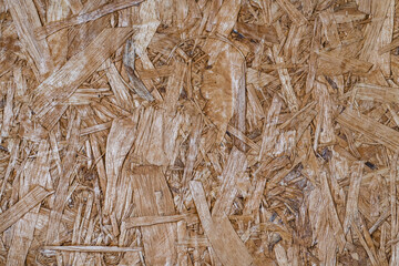 OSB wood texture background with rough and natural wooden patterns. Perfect for rustic, industrial, and eco-friendly designs.