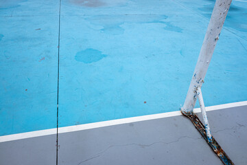 mini football goal post in a public blue court