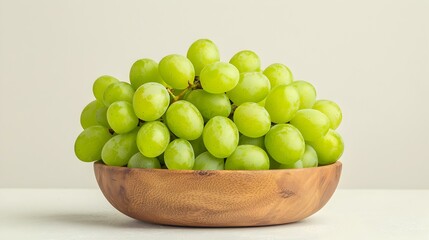 Fresh Green Grapes in a Wooden Bowl Isolated on Light Background