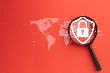 Close-up of a magnifying glass focusing on a digital shield with a lock, symbolizing cybersecurity,...