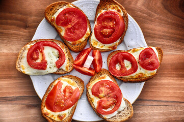 Tasty toast with tomato and cheese
