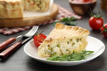 Piece of delicious fresh homemade pie served on wooden table, closeup