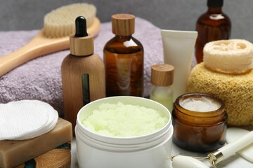 Different body care products on table, closeup