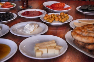 Turkish breakfast. Honey, olives, tomatoes, breads, jam, cheese, clotted cream
