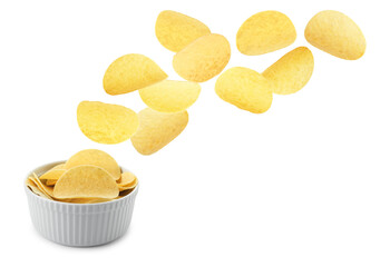 Tasty potato chips falling into bowl on white background