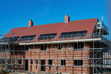 Close Up Of New Housing Development Including Solar Energy Panels On Roof