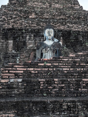Sukhothai Buddha: Serenity Amidst the Bricks