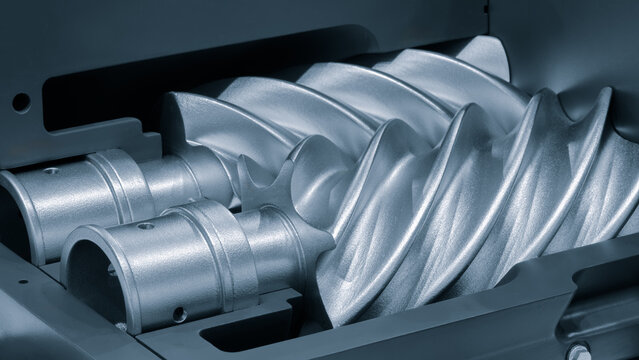 Silver gear with a pointed end and a spiral shape. The spiral shape is very sharp and the gear is very shiny.