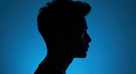 Silhouetted Man Portrait Against Electric Blue Background