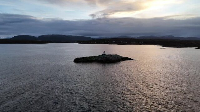 Drone view of sea mark on the rocky islet of Galten at dawn in Sveggevika bay