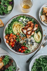 Delicious chicken salad bowl with mixed greens, avocado, and blue cheese