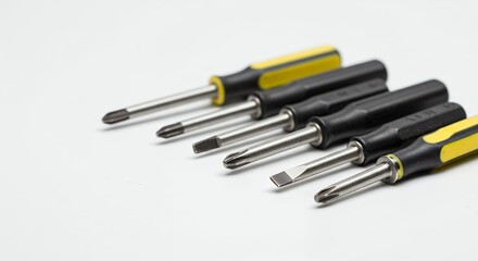 Assorted Screwdrivers on White Surface Arranged for Easy Access and Visibility
