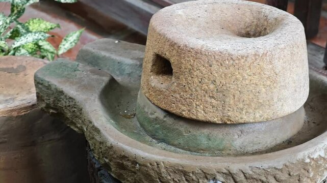 Antique hand-cranked stone mill 