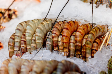 Close-up of fresh chilled shrimp on a store shelf. Concept of fresh seafood, shopping and healthy eating.