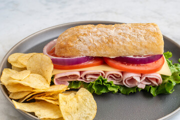 ham sub  served with potato chiprs
