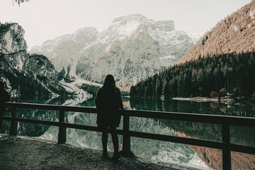 lago die braies lake view of silhouette Woman standing by lake against mountains
