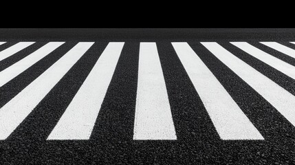 A black and white crosswalk on a road.