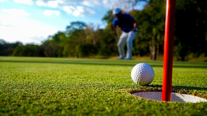Golfers are putting golf in the evening golf course golf backglound.