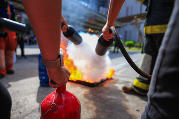 Company employees are undergoing basic fire extinguishing training, fire extinguisher use, safety...