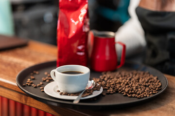 Skilled barista woman carefully brewing a rich and aromatic Americano coffee with precision and passion