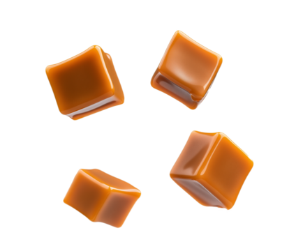 Caramel cubes flying in air isolated on white background. Set of delicious caramel candies floating isolated on white background. caramel cubes. 