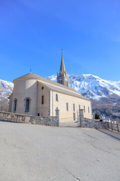 Church of Saint-Laurent in Orci&egrave;res , France, with Snow-Capped Mountains