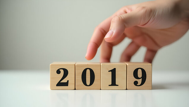 Flat hand change wooden cubes new year 2019 2020 concept concept as A hand flips wooden cubes to transition from 2019 to 2020 symbolizing change progress and new beginnings. in  Simple flat cute vecto - Powered by Adobe