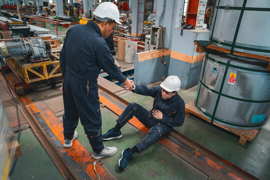 A man got factory accident serious industrial injury. Ensuring workplace safety helps prevent occupational injuries from machinery accidents, safety violations, and hazardous work environments.