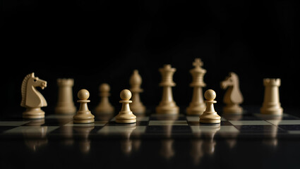 Chessboard with chess pieces on black background leader business concept as Chessboard with chess pieces on black background symbolizing business leadership and strategic decision making in  Photo Sto